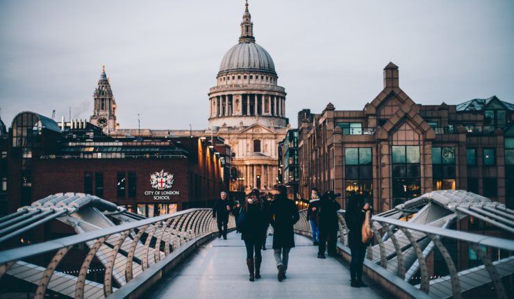People walking over a bridge