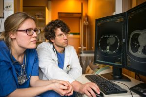 nurse and doctor using computer