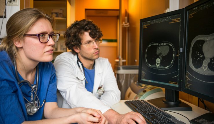 nurse and doctor using computer