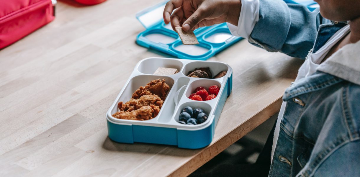Boy eating pack lunch