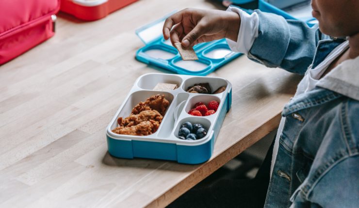 Boy eating pack lunch