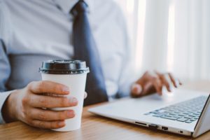 Man with coffee and laptop