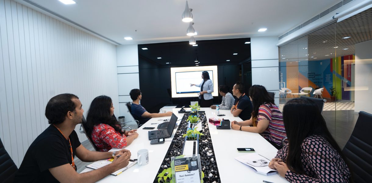 men and women in meeting