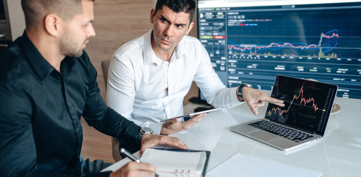 2 men looking at data