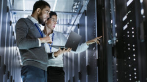 Man and woman looking at the data