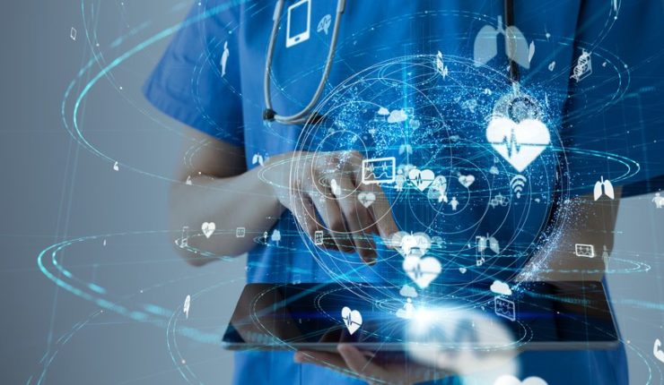 Doctor using tablet device, medical data symbols