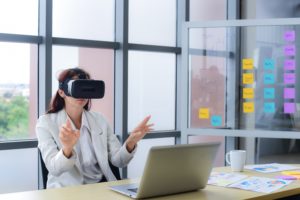 Woman using VR in the office