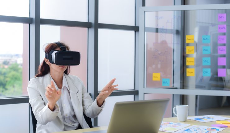 Woman using VR in the office