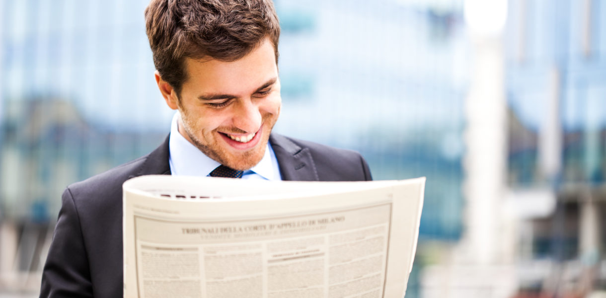 man reading newspaper