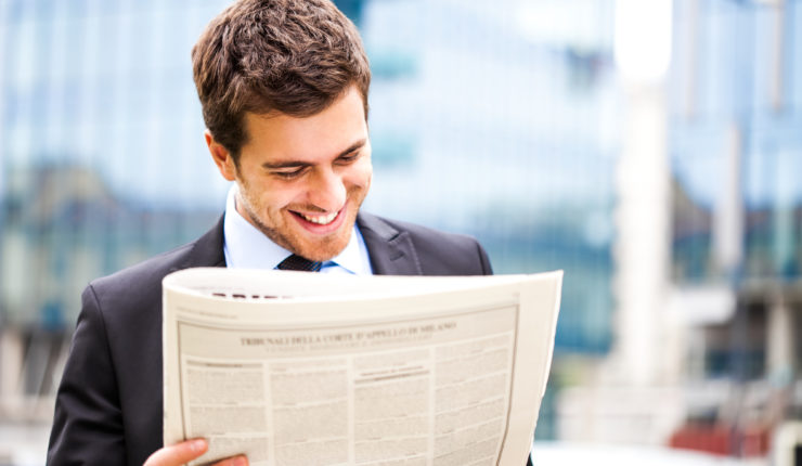 man reading newspaper