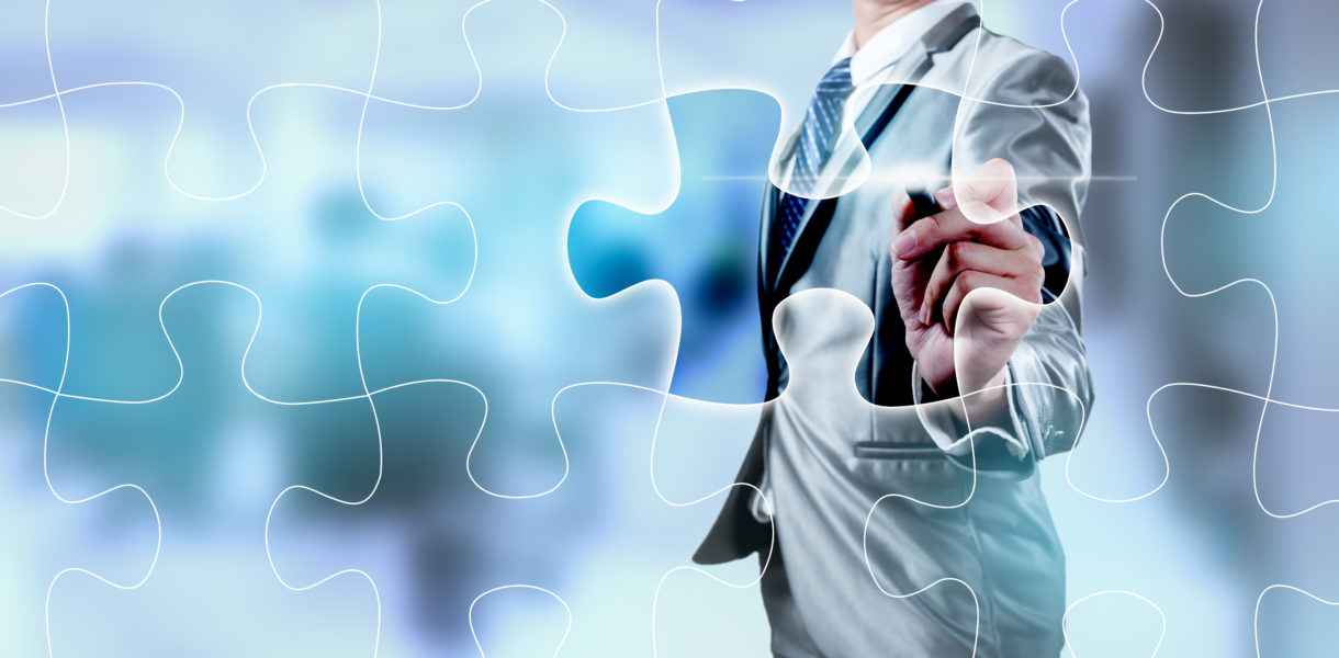 Businessman,Working,On,Digital,Jigsaw,Screen,,Business,Strategy,Concept