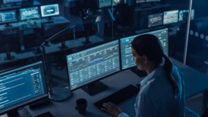 Female,Software,Engineer,Working,In,A,Modern,Monitoring,Office,With