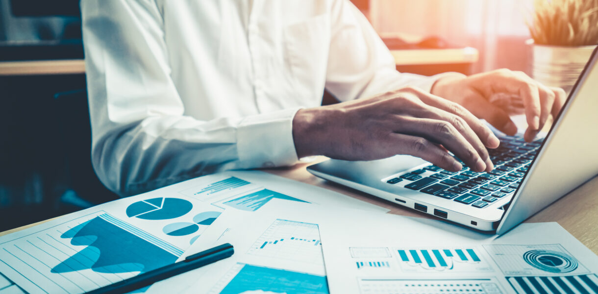 Businessman,Accountant,Or,Financial,Expert,Analyze,Business,Report,Graph,And