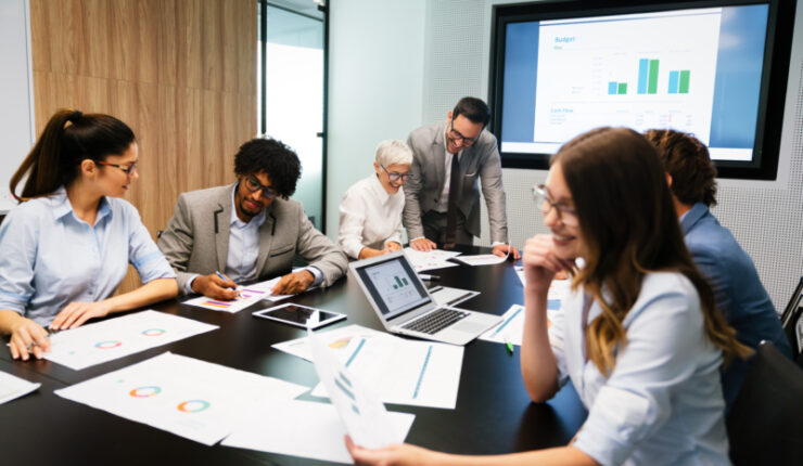 Image,Of,Business,Partners,Discussing,Documents,And,Ideas