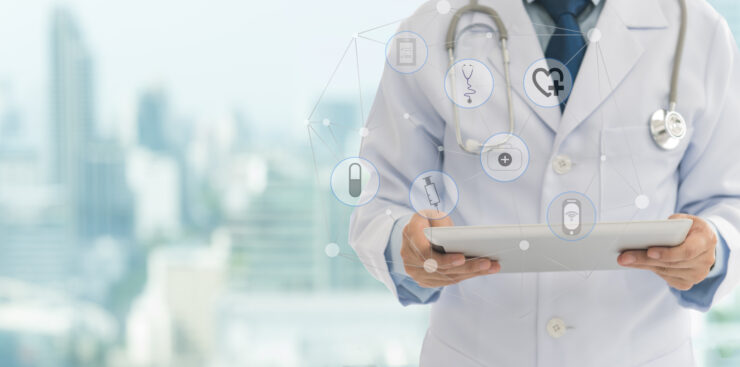 Doctor,Or,Medical,Students,Using,Digital,Tablet,With,Medical,Icon