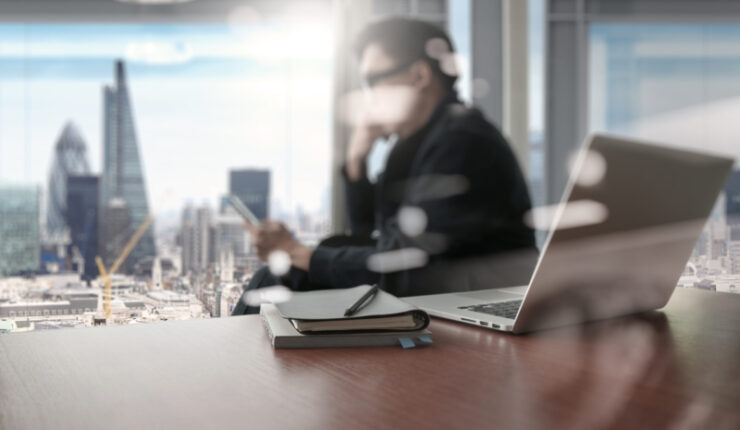 Designer,Hand,Working,And,Smart,Phone,And,Laptop,On,Wooden