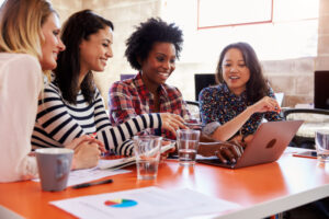 Group,Of,Female,Designers,Having,Meeting,In,Modern,Office
