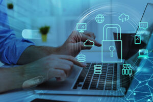 Businesswoman,With,Laptop,,Desktop,At,Office,Interior,,Blue,Glowing,Information