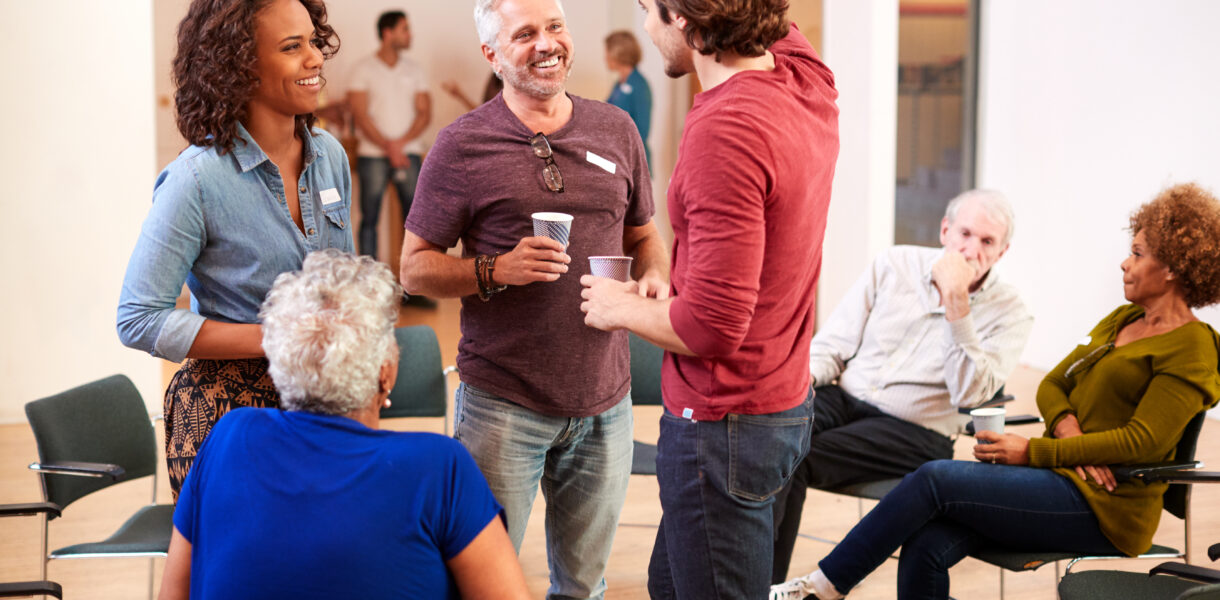 Group,Of,People,Socializing,After,Meeting,In,Community,Center